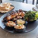 Al Barakeh Mixed Plate Skewers – Chicken, lamb, kafta & sweet potato skewers with tabouli, garlic, hummus, baba ghannouj & bread